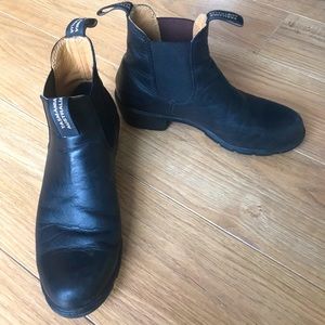 Black Blundstone boots.